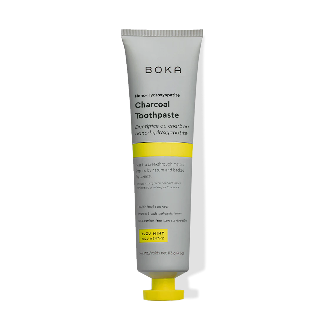 A tube of Charcoal Yuzu Mint n-Ha Toothpaste with a yellow and gray design.