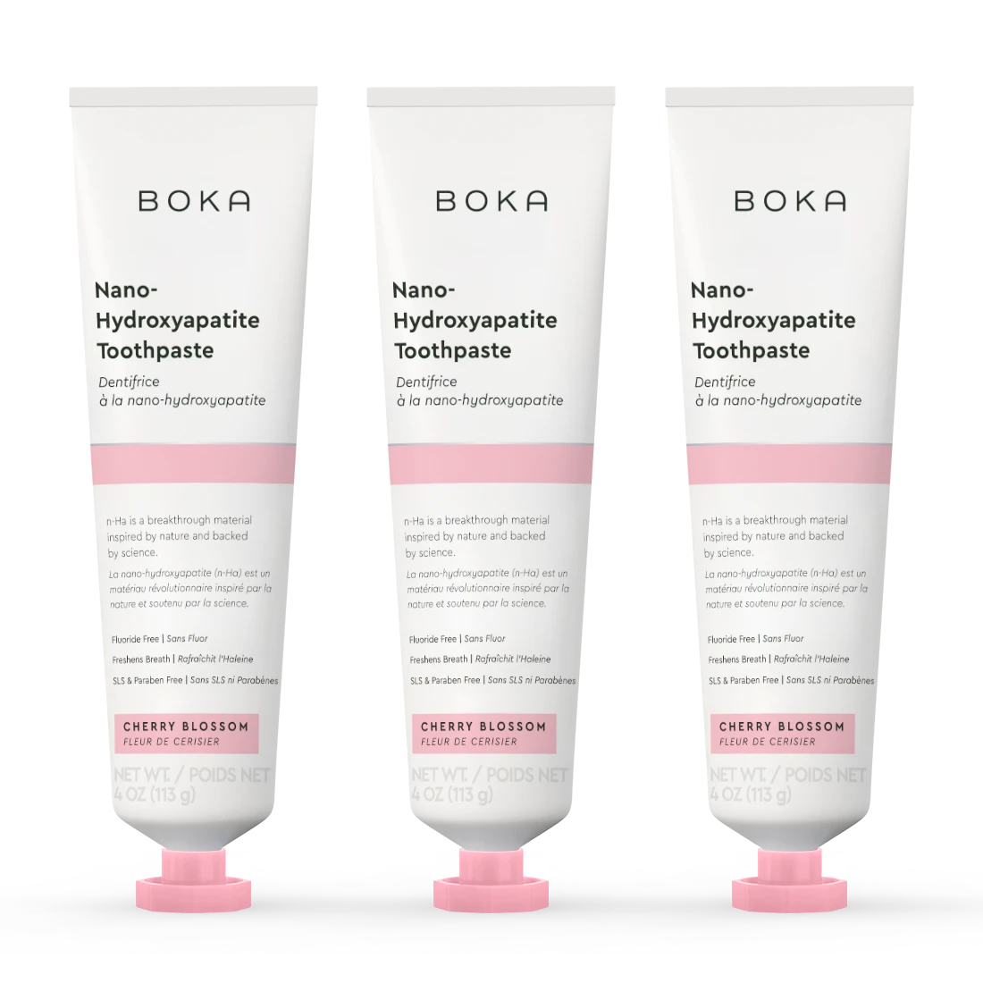 Three tubes of Boka Nano-Hydroxyapatite Toothpaste with cherry blossom flavor on a white background.