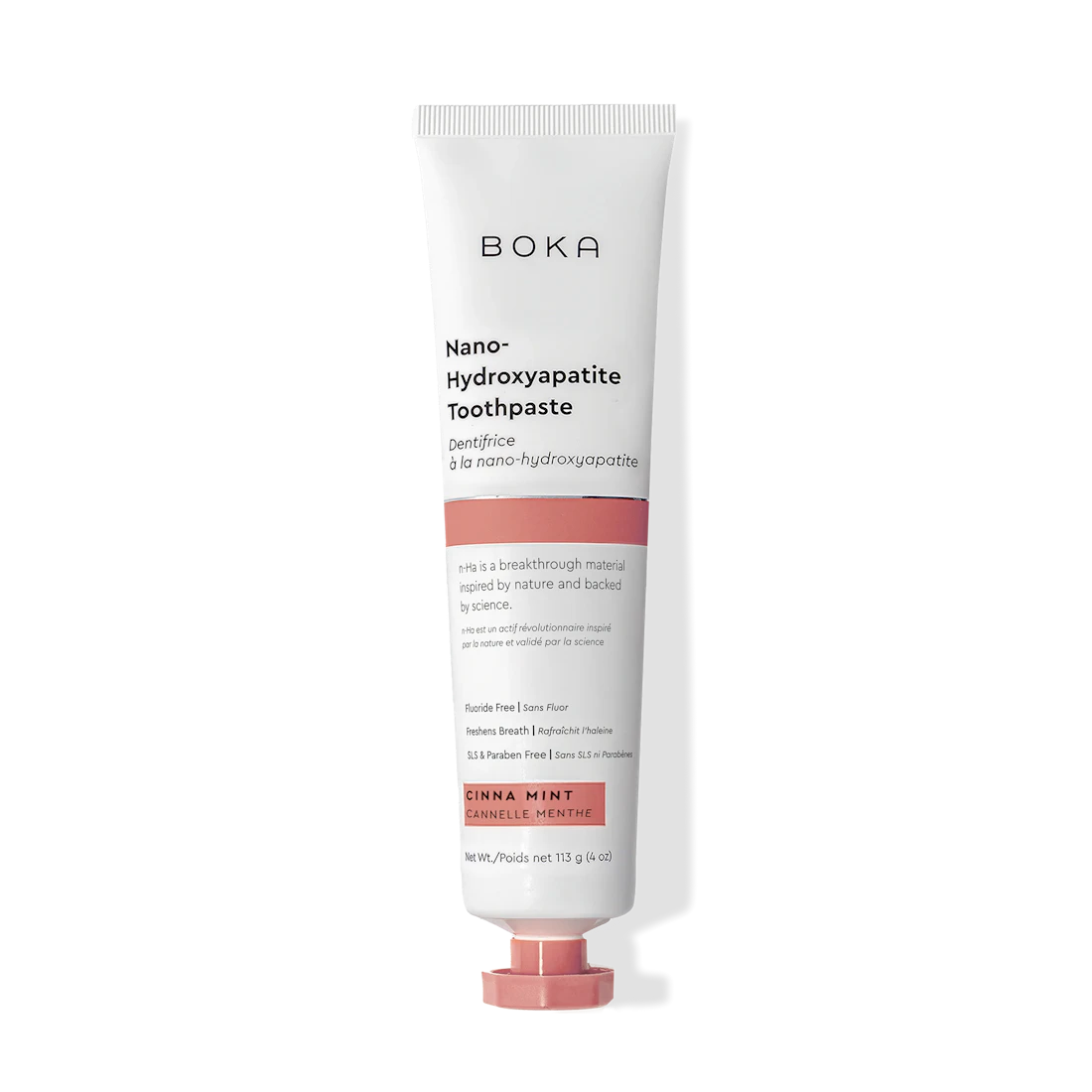 A tube of Cinna Mint n-Ha Toothpaste, fluoride free, in orange flavor stands upright.