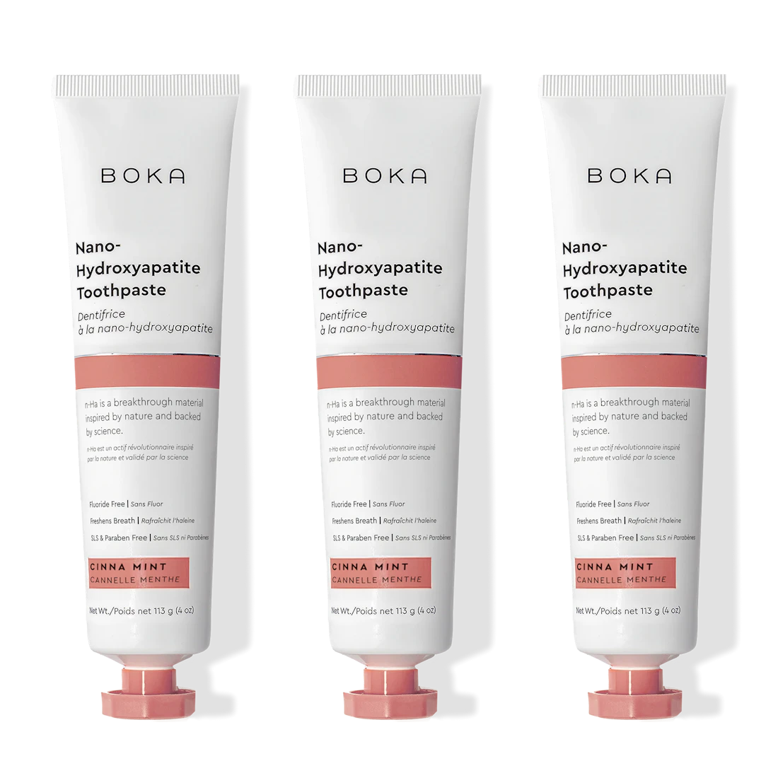 Three tubes of Cinna Mint n-Ha Toothpaste, fluoride free, in pink and white packs.