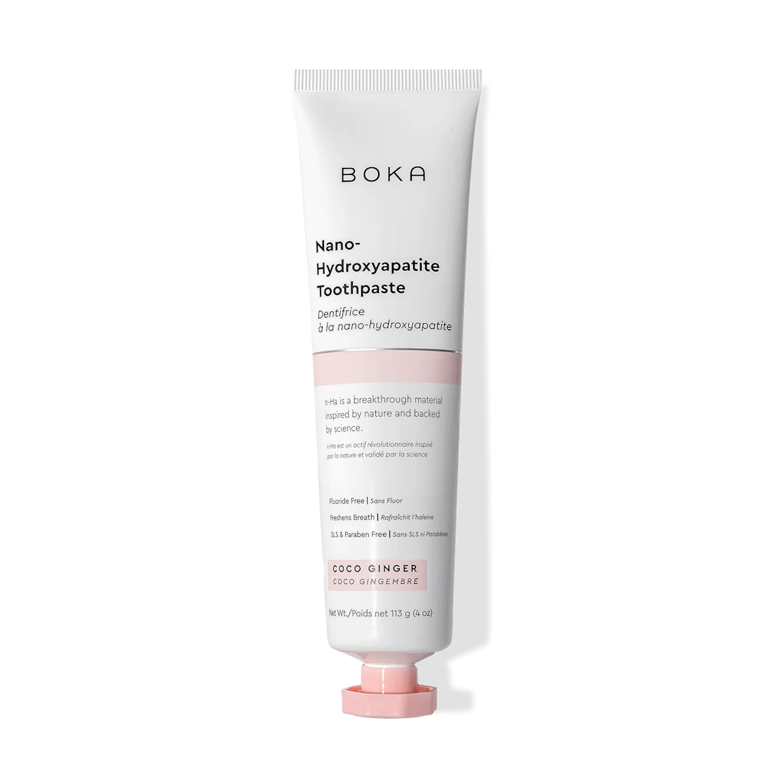 A tube of Coco Ginger n-Ha Toothpaste featuring a white and pink design.