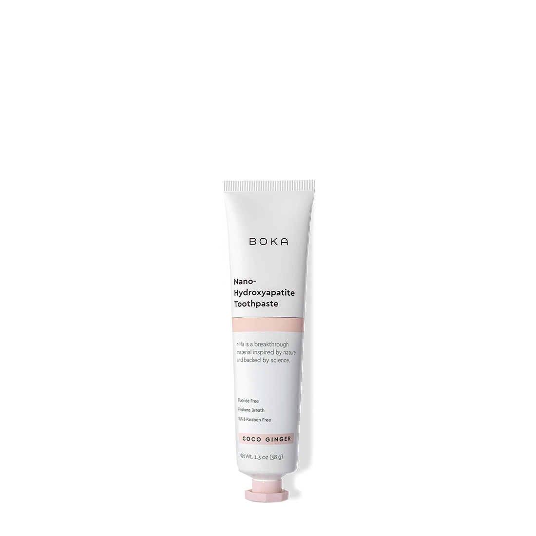 A tube of Coco Ginger Travel Size n-Ha Toothpaste on a plain background.