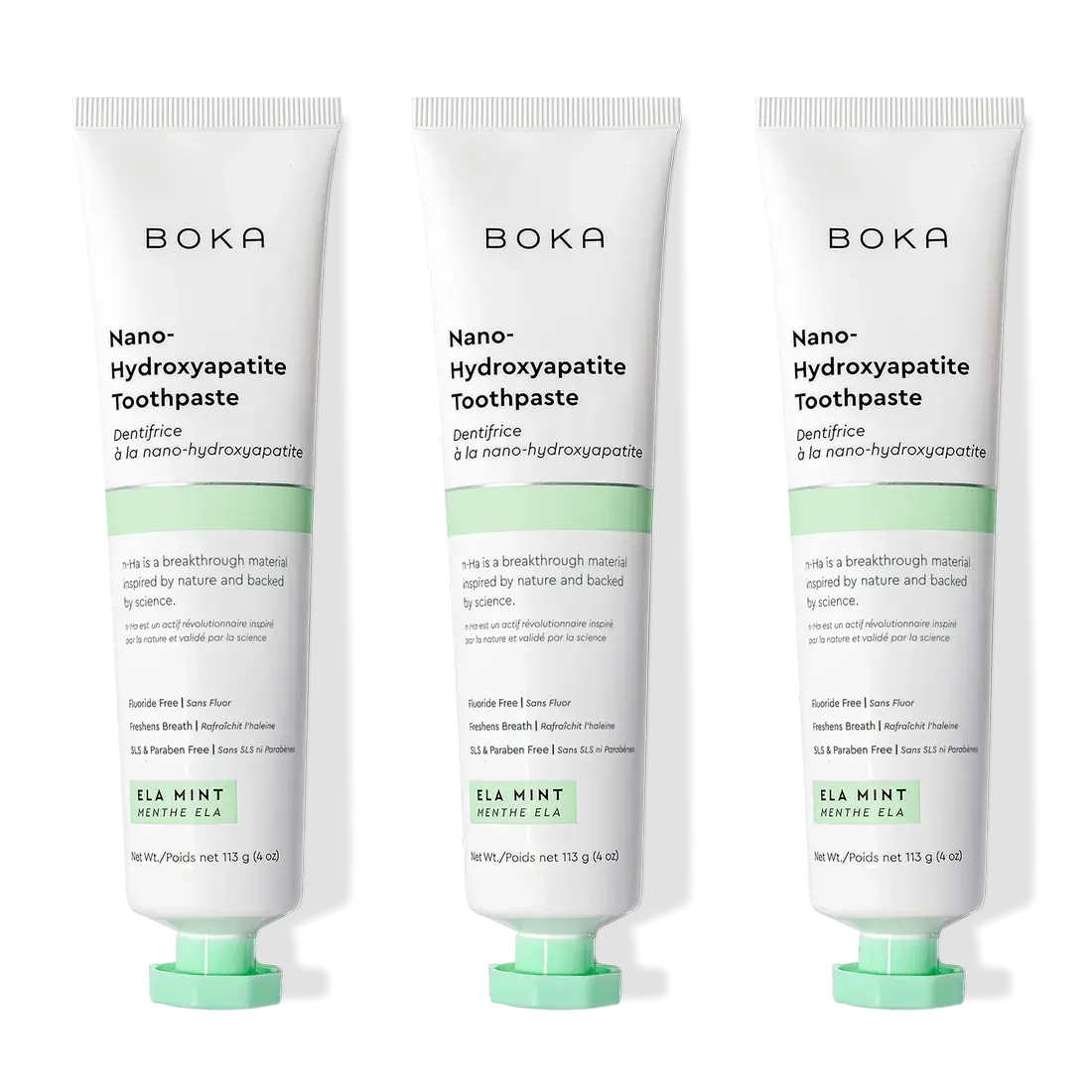 Three tubes of Ela Mint n-Ha Toothpaste stand upright, ideal for daily oral care routines.