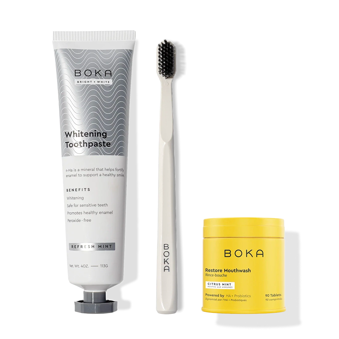 Fresh Faced toothpaste, activated charcoal toothbrush, and yellow Restore Mouthwash side by side.