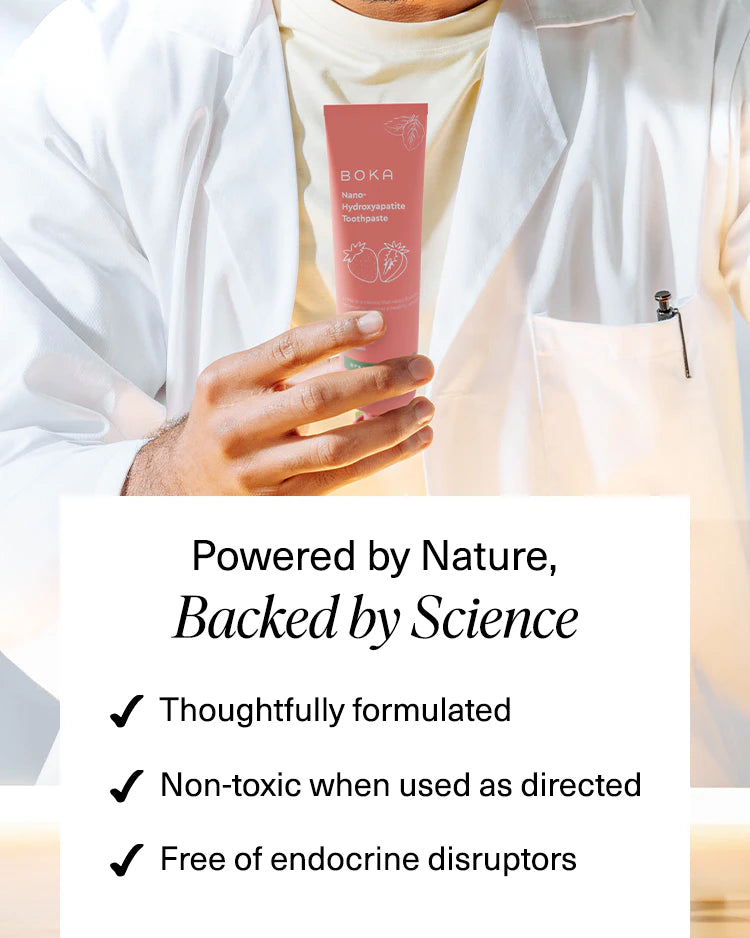 A person in a lab coat holds Boka toothpaste; text lists its natural, non-toxic, and safe features.