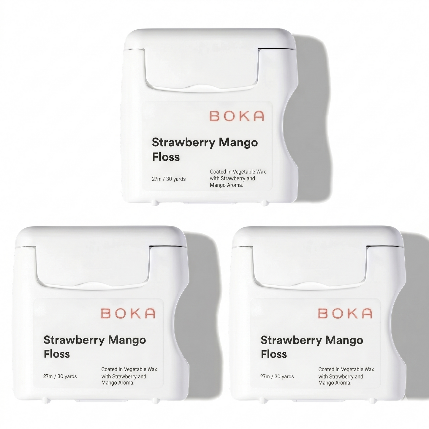 Three packages of Boka Strawberry Mango Floss on a white background