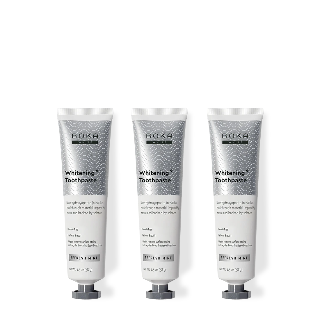 Three tubes of Boka Toothpaste on a white background
