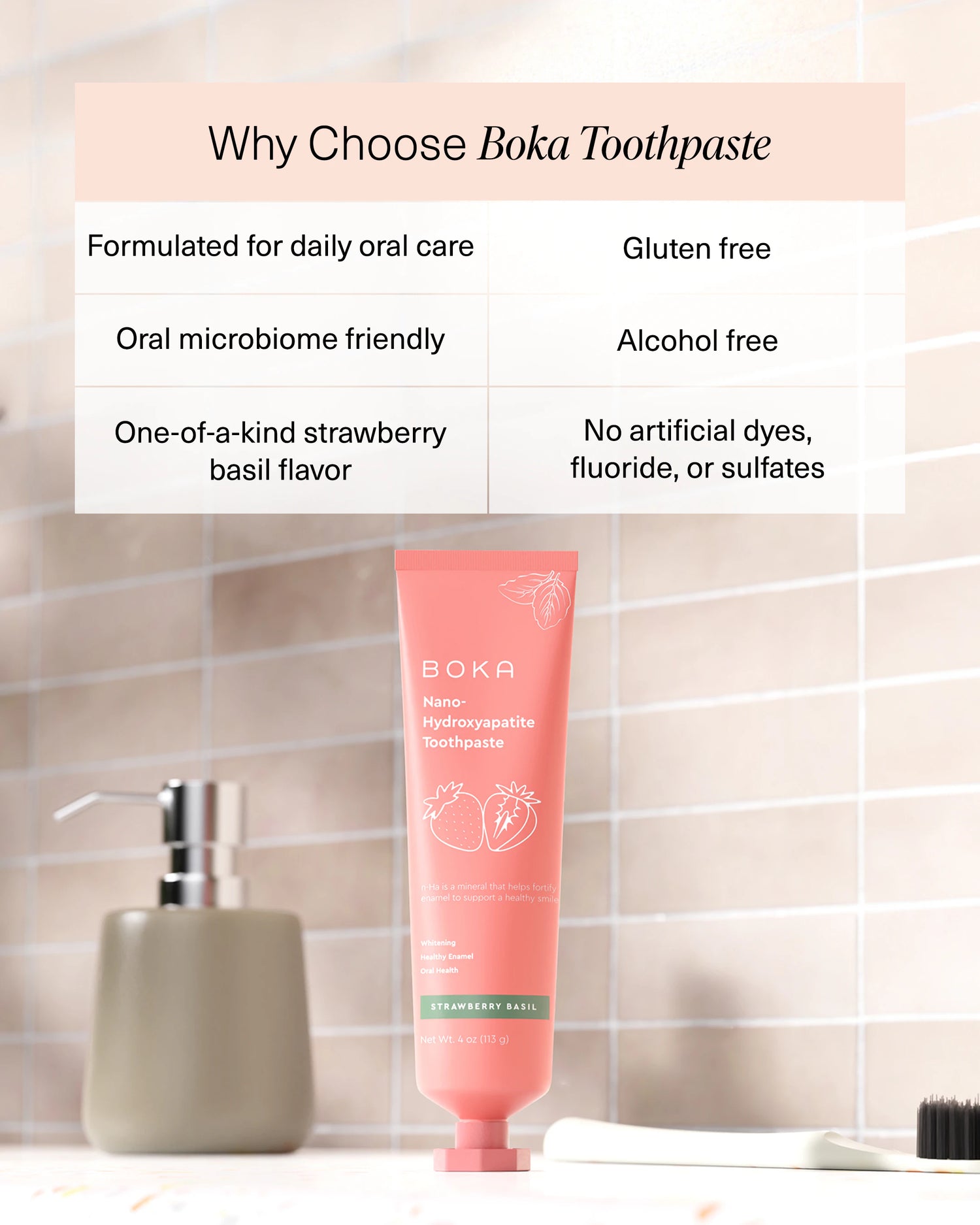 Boka Strawberry Basil toothpaste tube on a bathroom counter, benefits listed above in a chart.