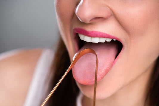6 Surprising Benefits of Tongue Scraping (+Tips & More)