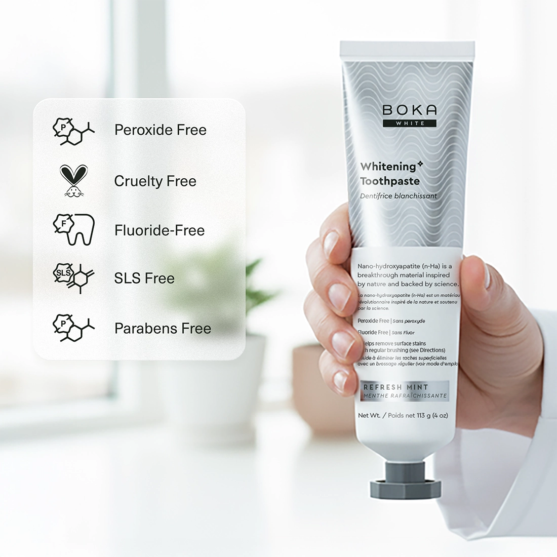Boka Whitening Toothpaste tube held by a hand with product features listed on the left.
