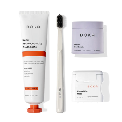 Advanced Kit: Boka toothpaste (safe if swallowed), toothbrush, tabs & floss on a white background.