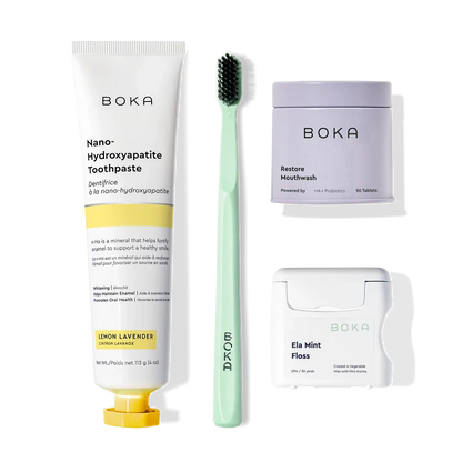 Advanced Kit: toothpaste (kid-safe), green brush, mouthwash tablets, mint floss on white.