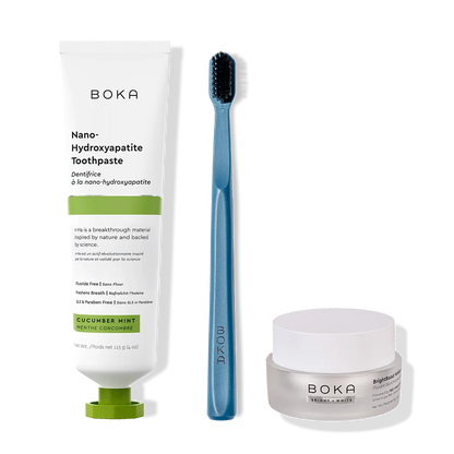 Boka toothpaste, toothbrush, and whitening powder on a white background