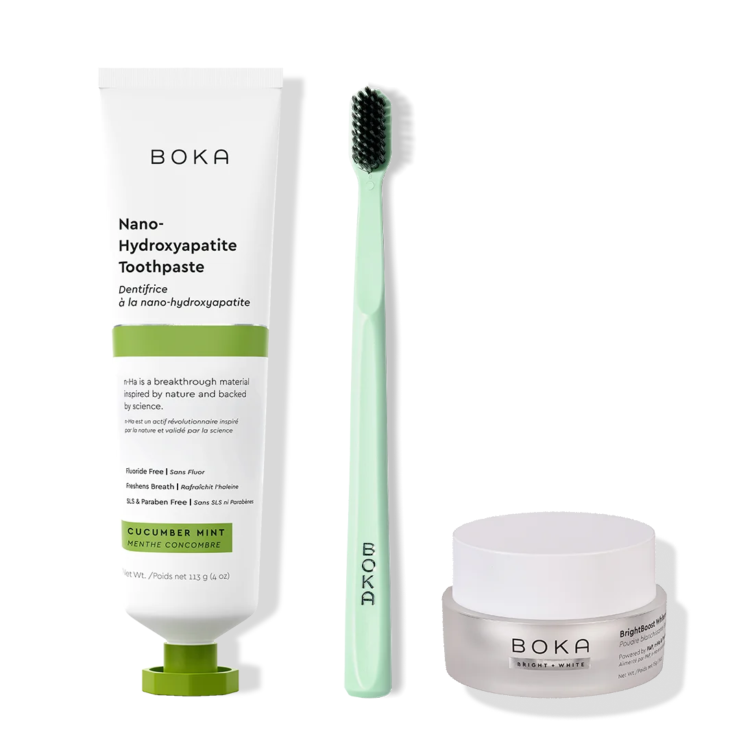 Boka toothpaste, toothbrush, and whitening powder on a white background
