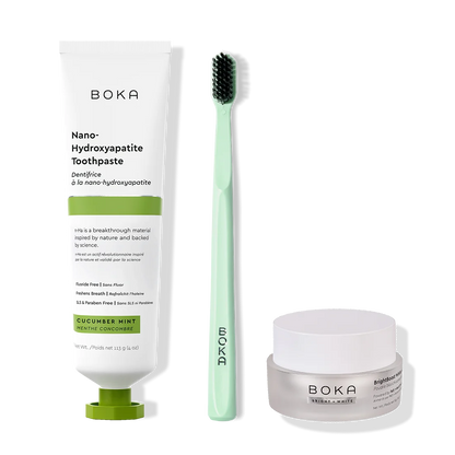 Boka toothpaste, toothbrush, and whitening powder on a white background