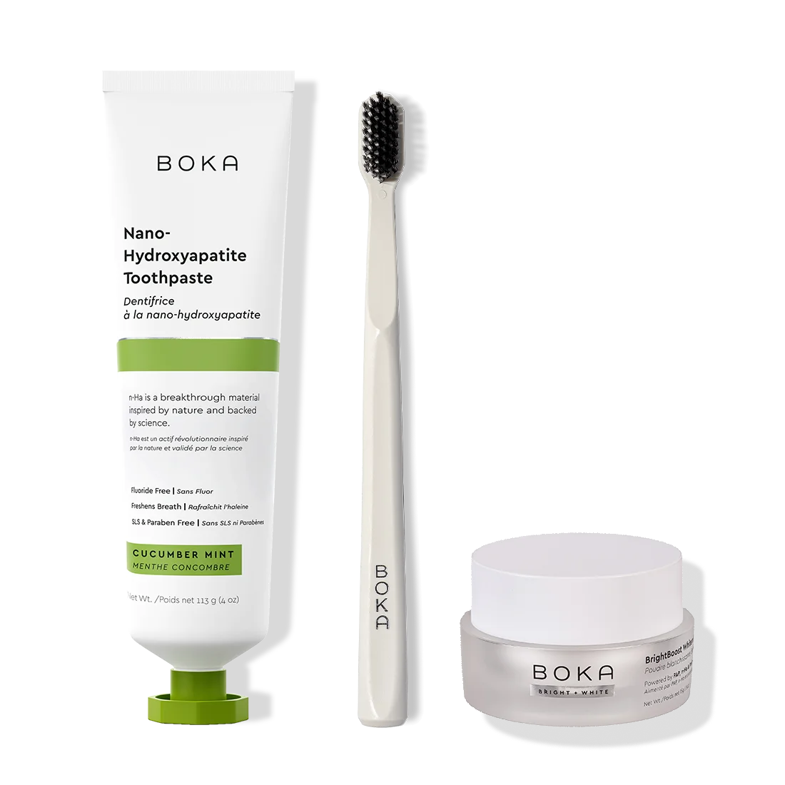 Boka toothpaste, toothbrush, and whitening powder on a white background