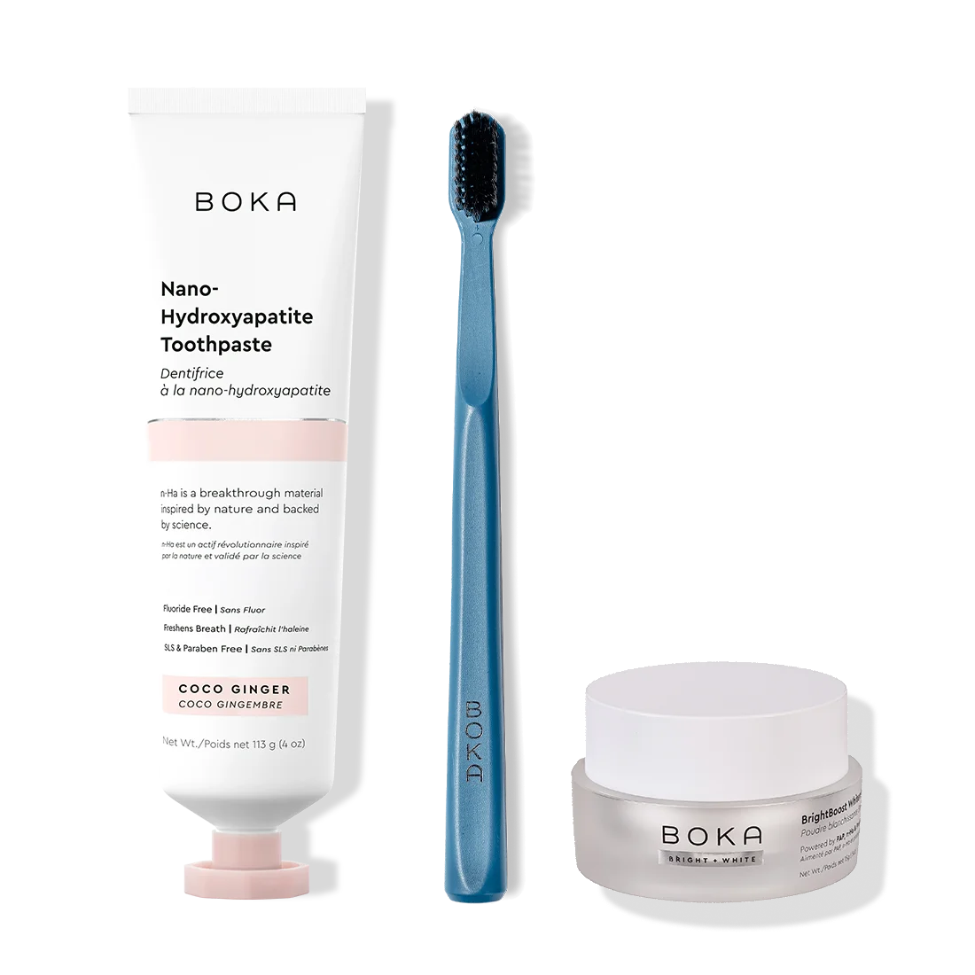 Boka toothpaste, toothbrush, and whitening powder on a white background