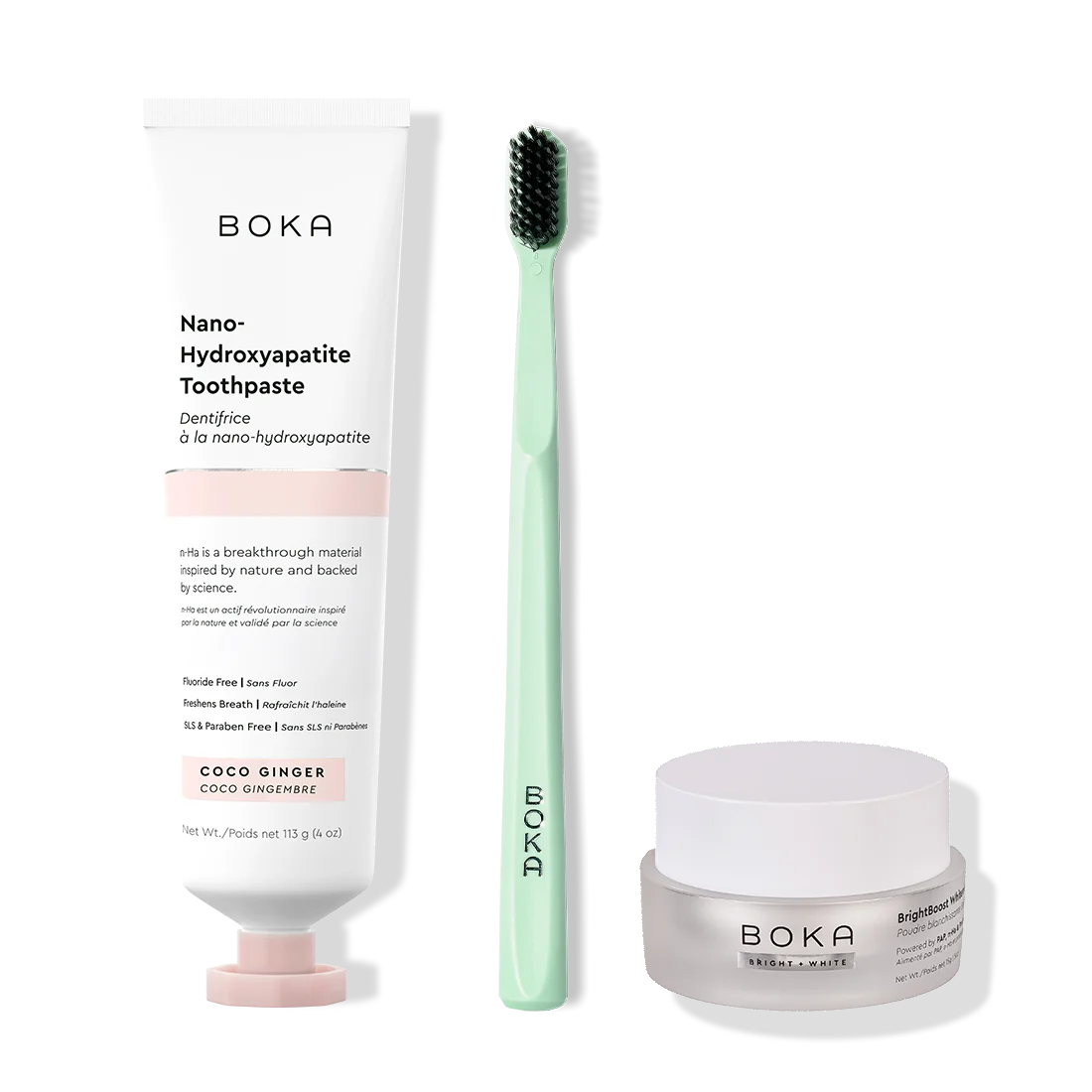 Boka toothpaste, toothbrush, and whitening powder on a white background