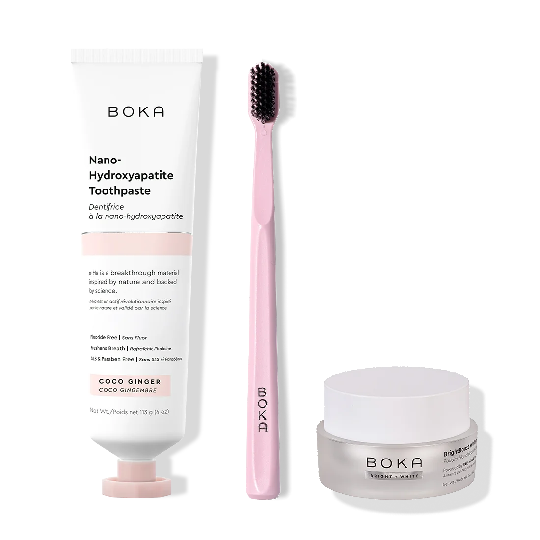 Boka toothpaste, toothbrush, and whitening powder on a white background