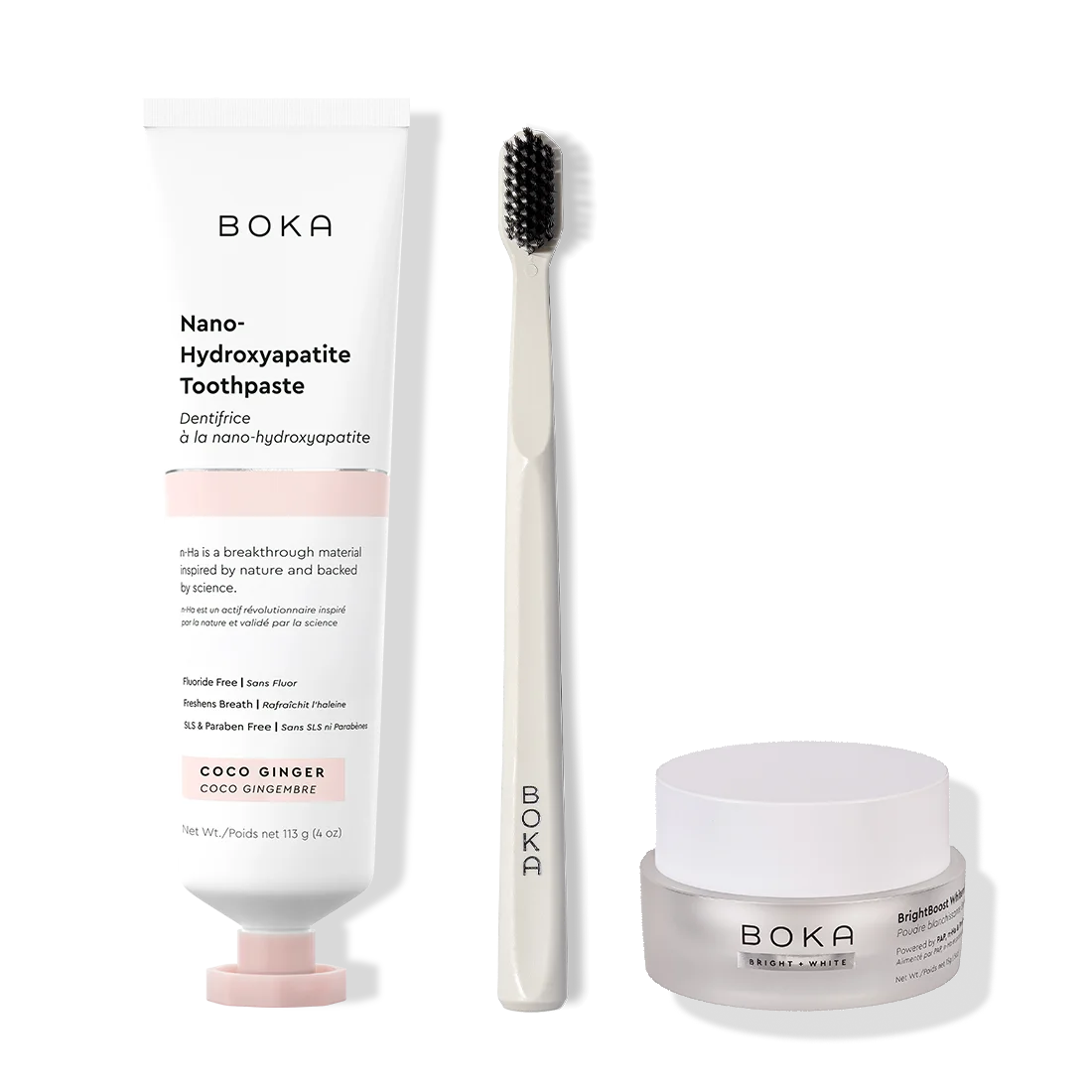 Boka toothpaste, toothbrush, and whitening powder on a white background