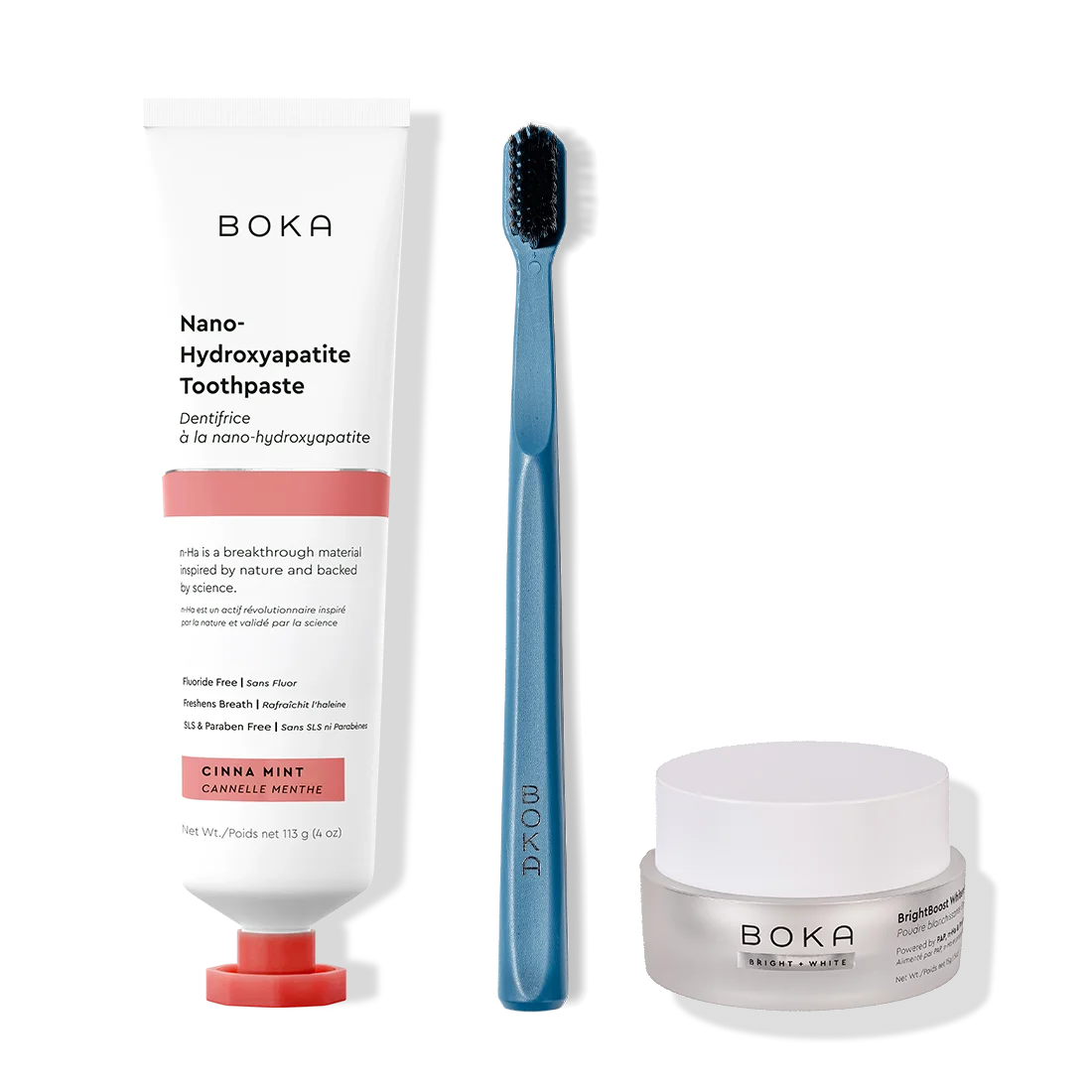 Boka toothpaste, toothbrush, and whitening powder on a white background