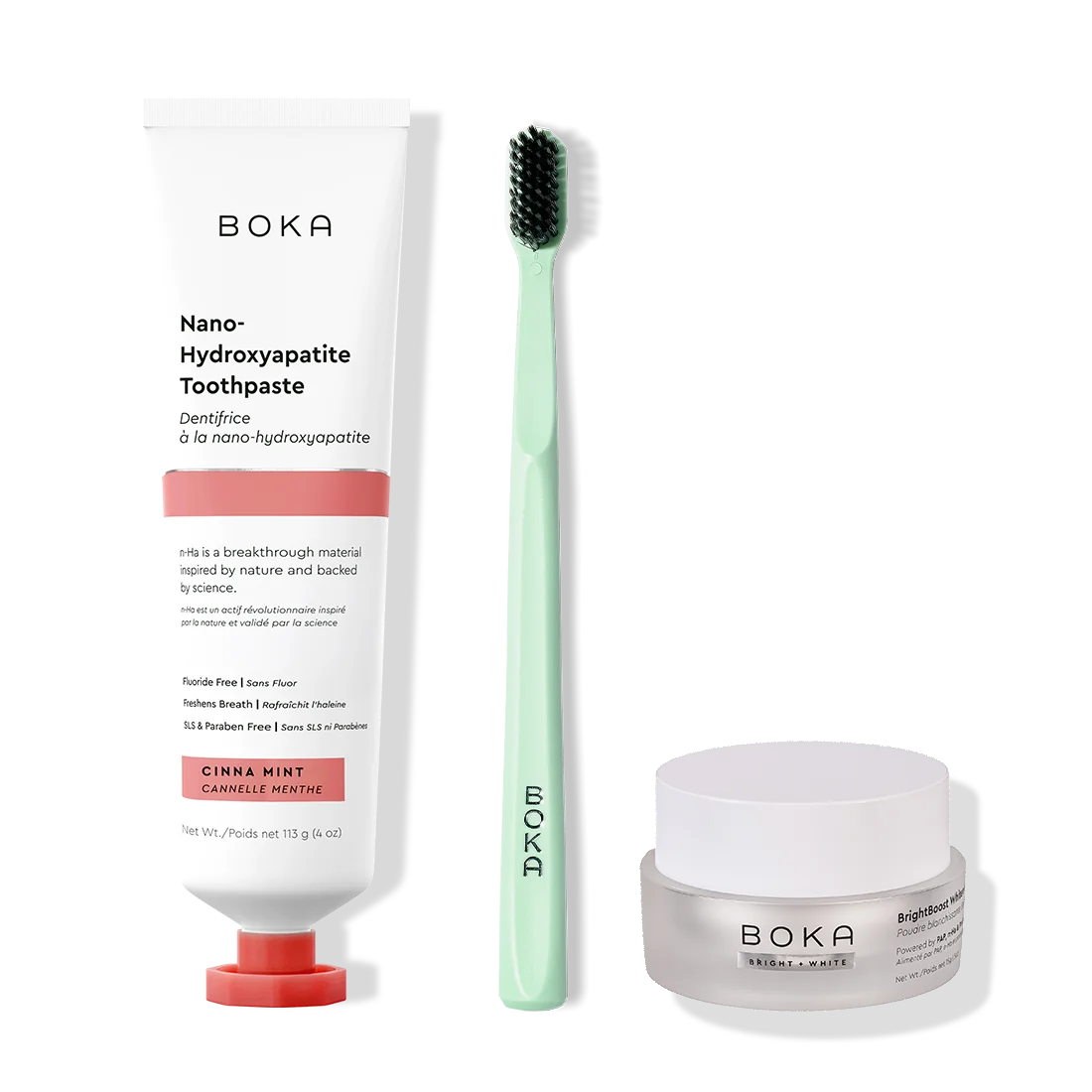 Boka toothpaste, toothbrush, and whitening powder on a white background