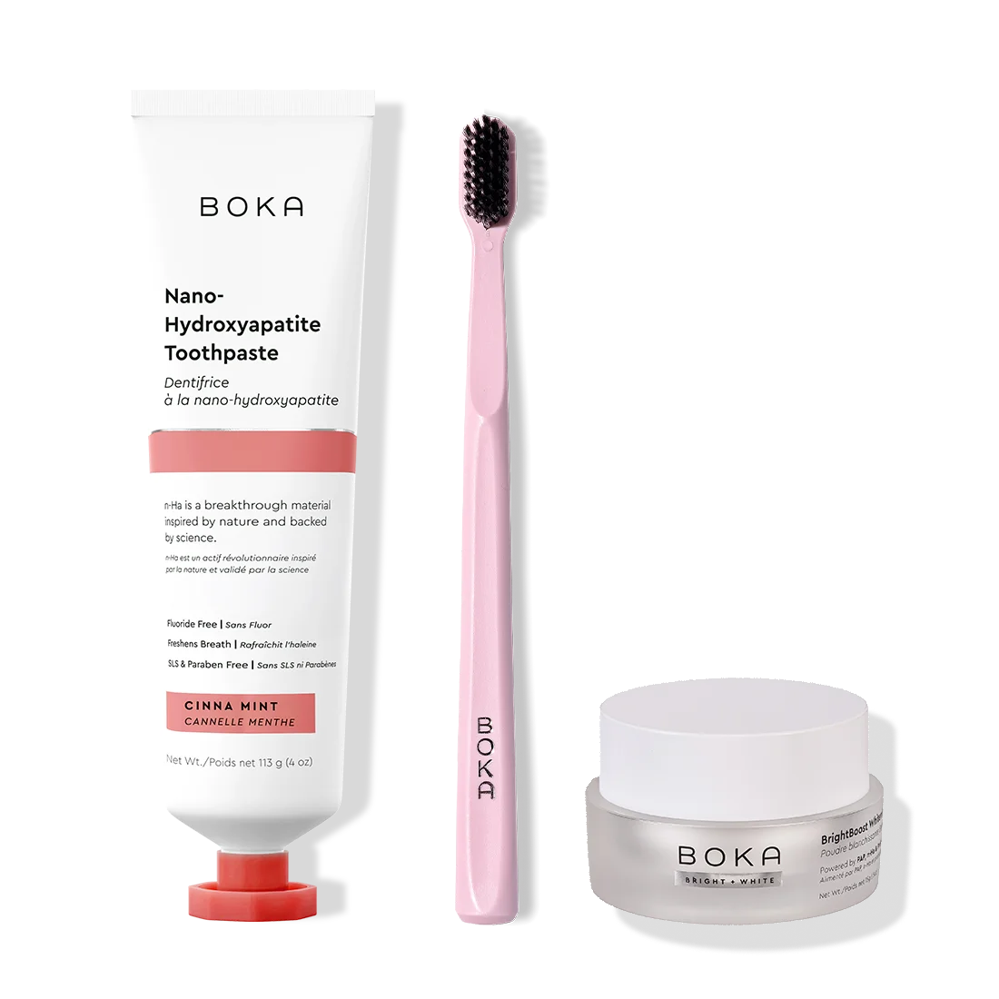 Boka toothpaste, toothbrush, and whitening powder on a white background