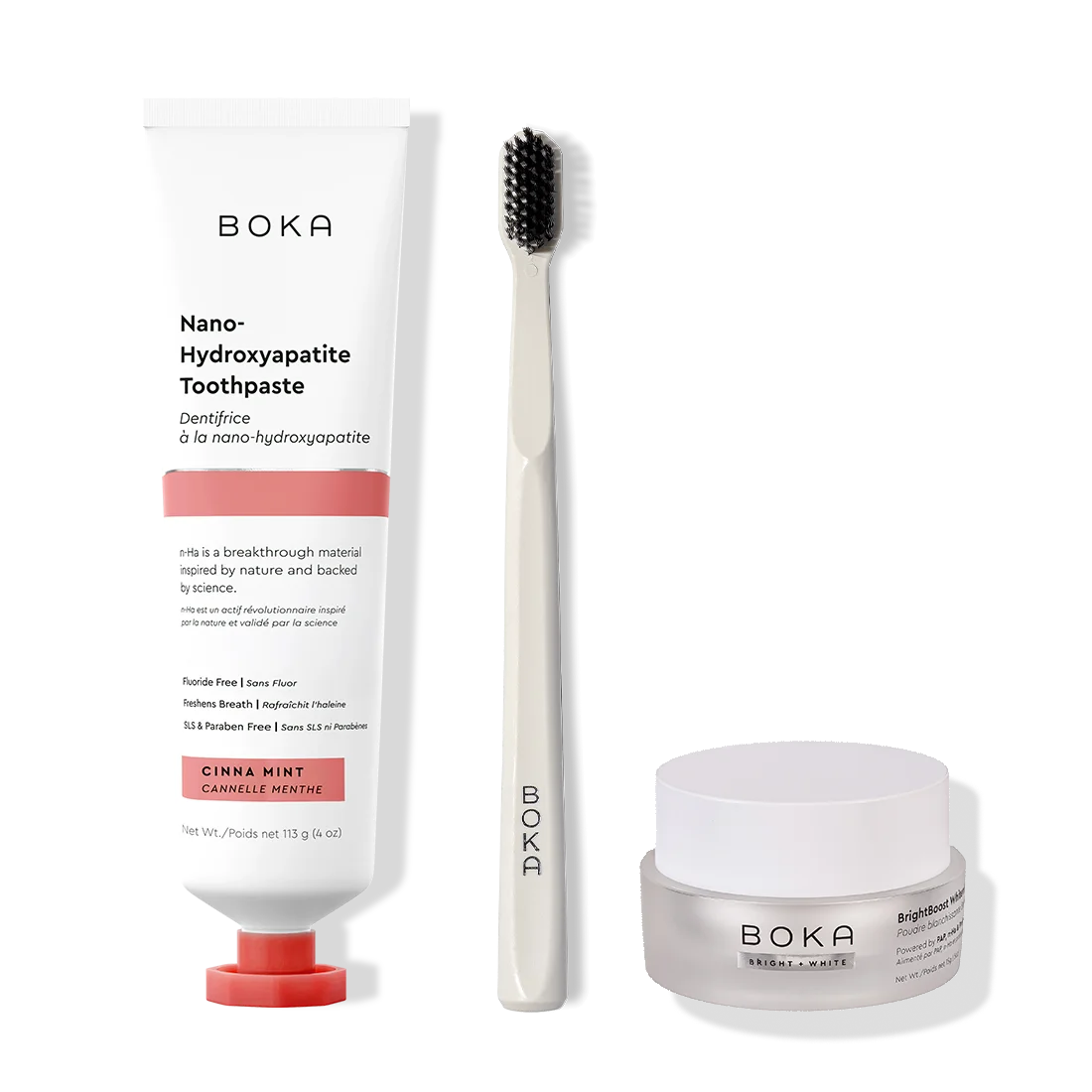 Boka toothpaste, toothbrush, and whitening powder on a white background