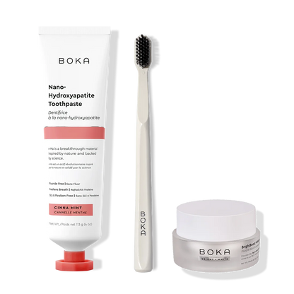 Boka toothpaste, toothbrush, and whitening powder on a white background