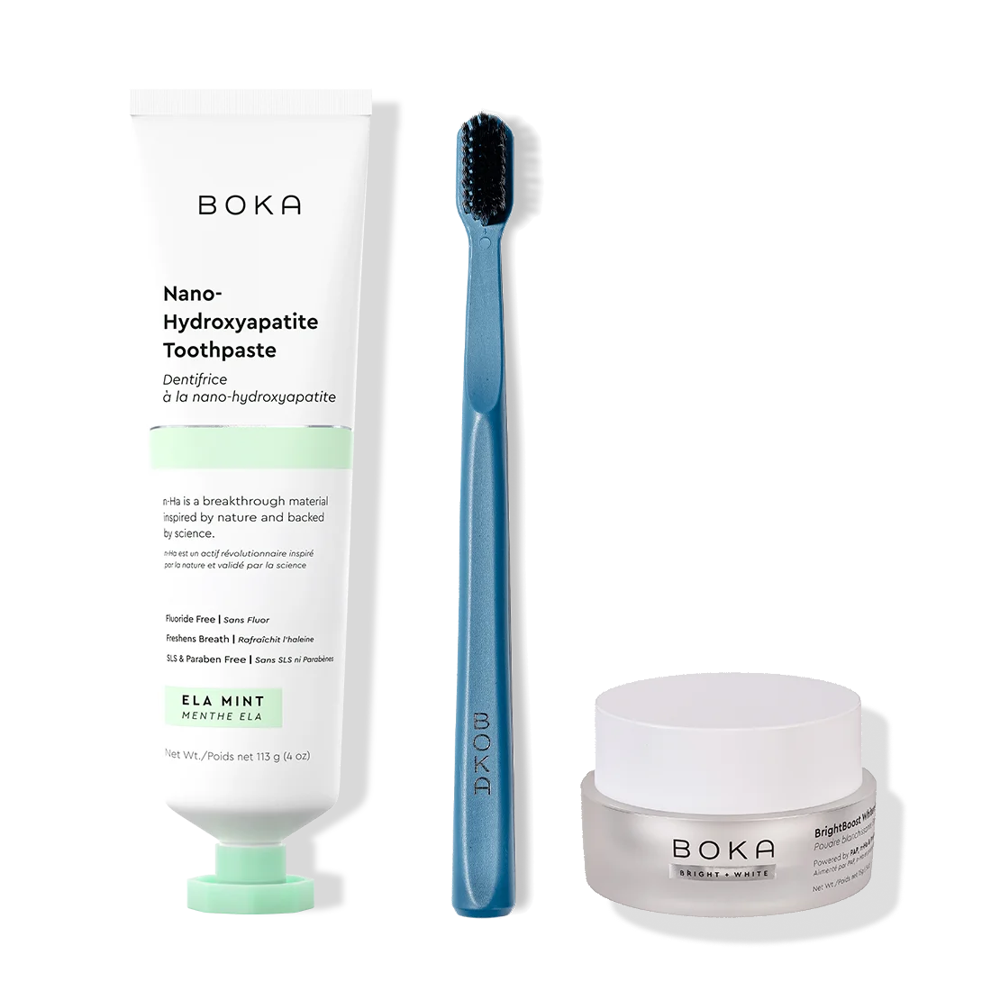 Boka toothpaste, toothbrush, and whitening powder on a white background