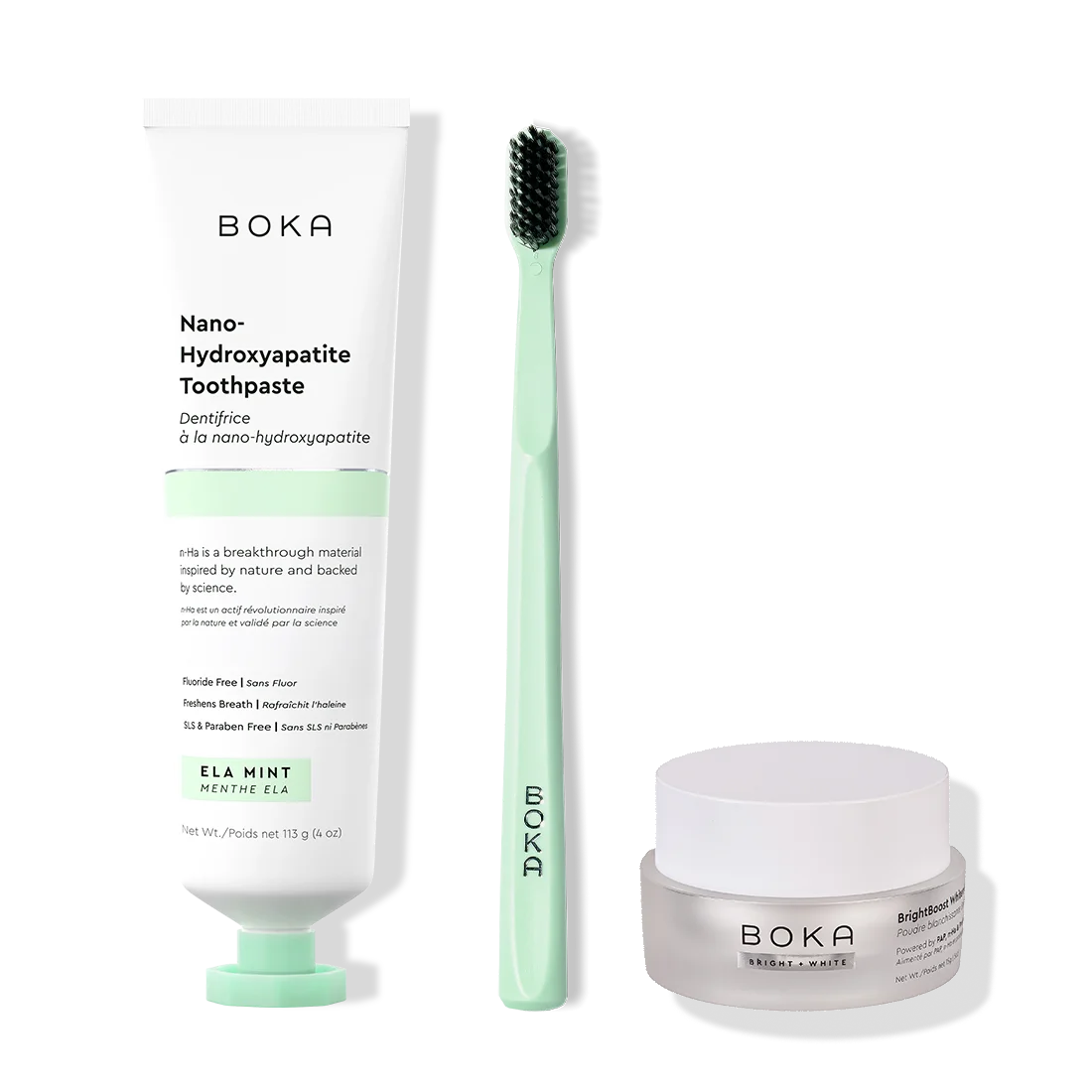 Boka toothpaste, toothbrush, and whitening powder on a white background