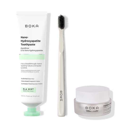 Boka toothpaste, toothbrush, and whitening powder on a white background