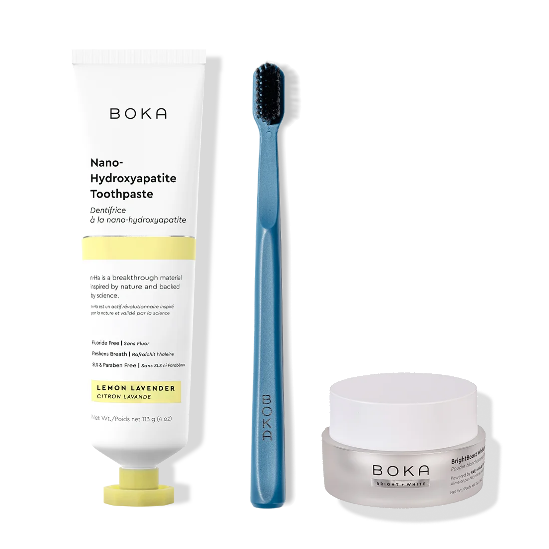 Boka toothpaste, toothbrush, and whitening powder on a white background