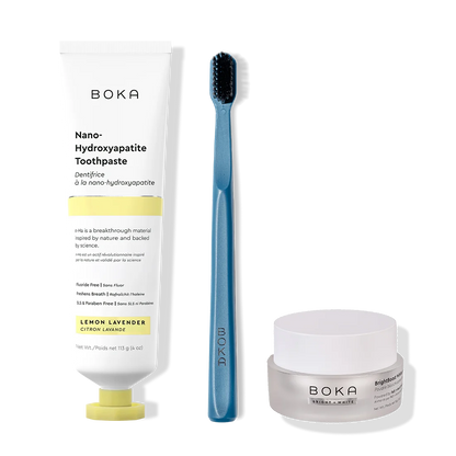 Boka toothpaste, toothbrush, and whitening powder on a white background