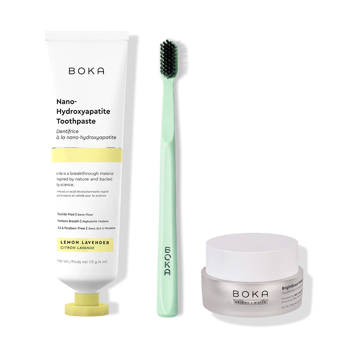 Boka toothpaste, toothbrush, and whitening powder on a white background
