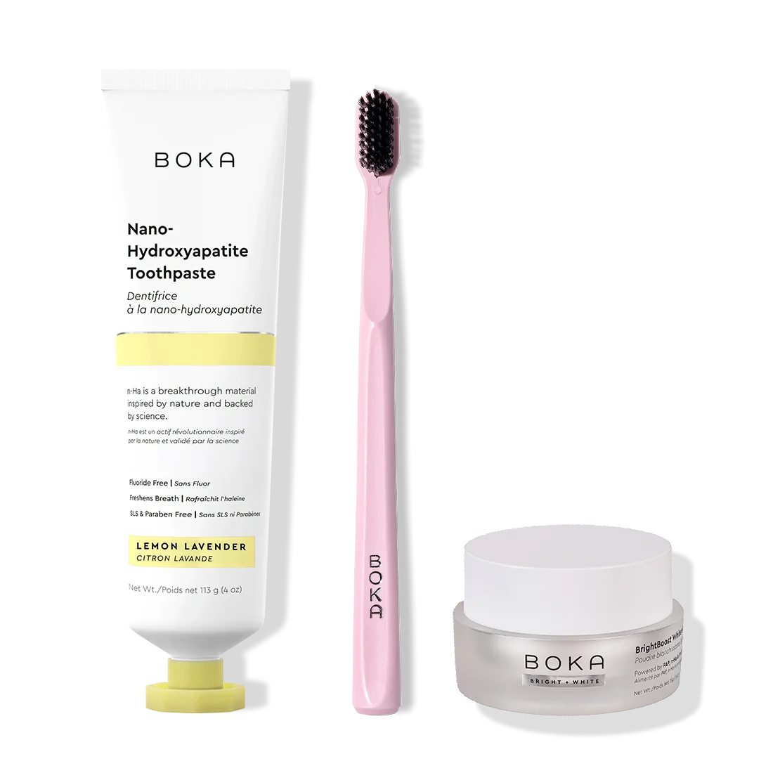Boka toothpaste, toothbrush, and whitening powder on a white background