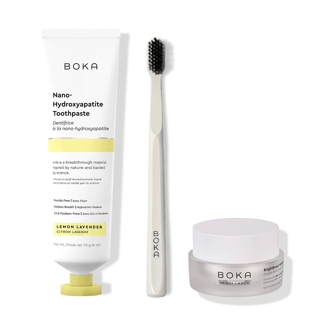 Boka toothpaste, toothbrush, and whitening powder on a white background