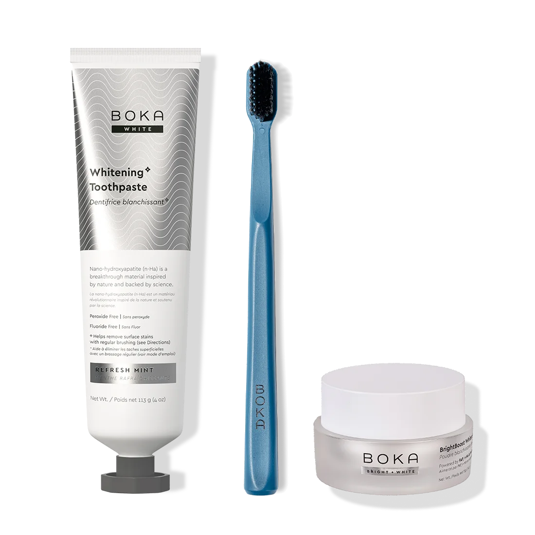 Boka toothpaste, toothbrush, and whitening powder on a white background