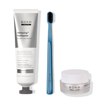 Boka toothpaste, toothbrush, and whitening powder on a white background
