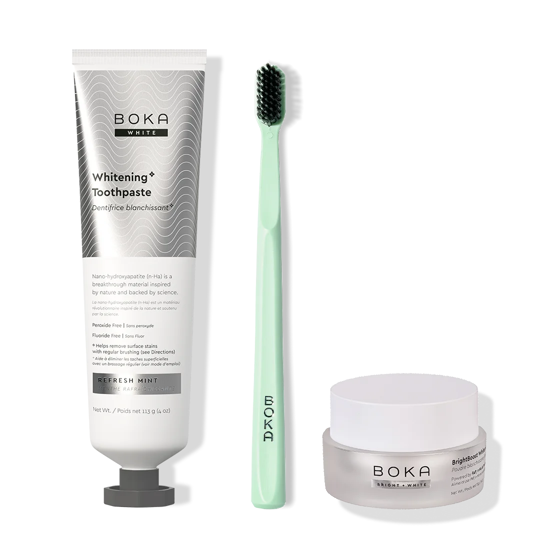 Boka toothpaste, toothbrush, and whitening powder on a white background
