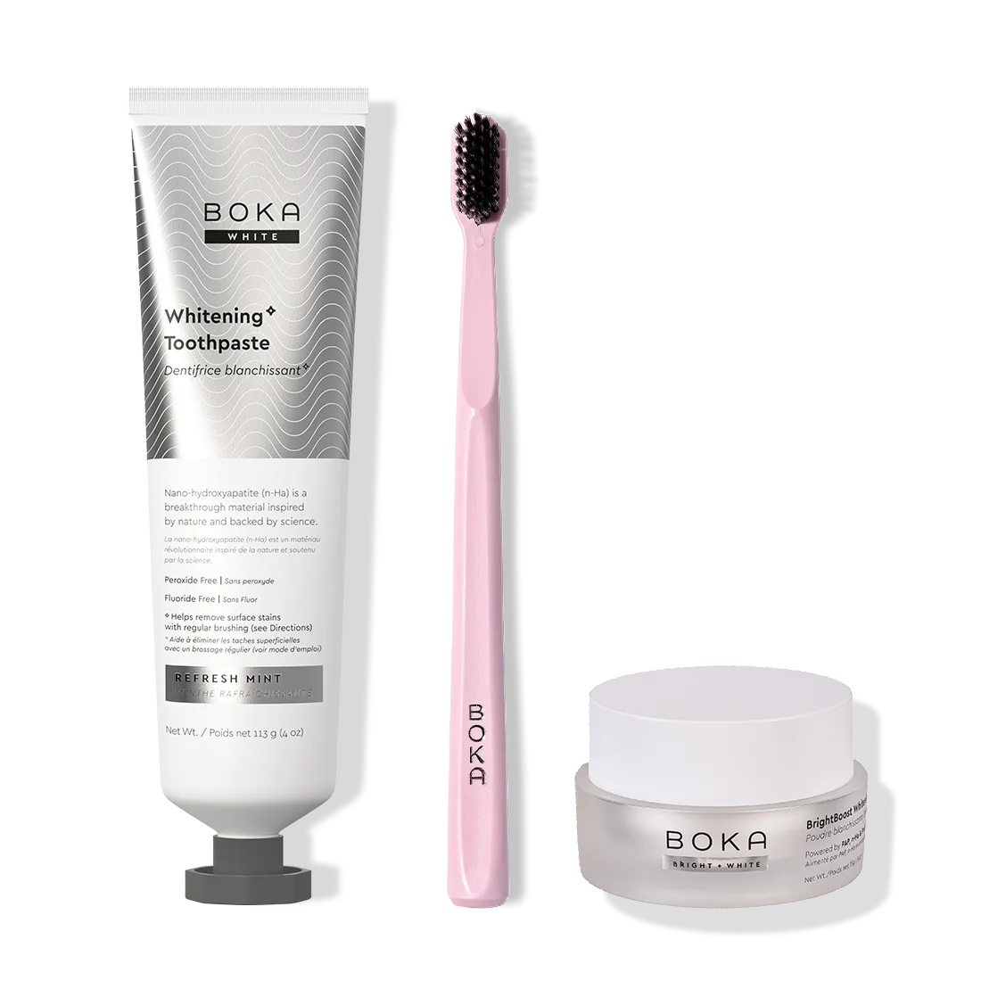 Boka toothpaste, toothbrush, and whitening powder on a white background