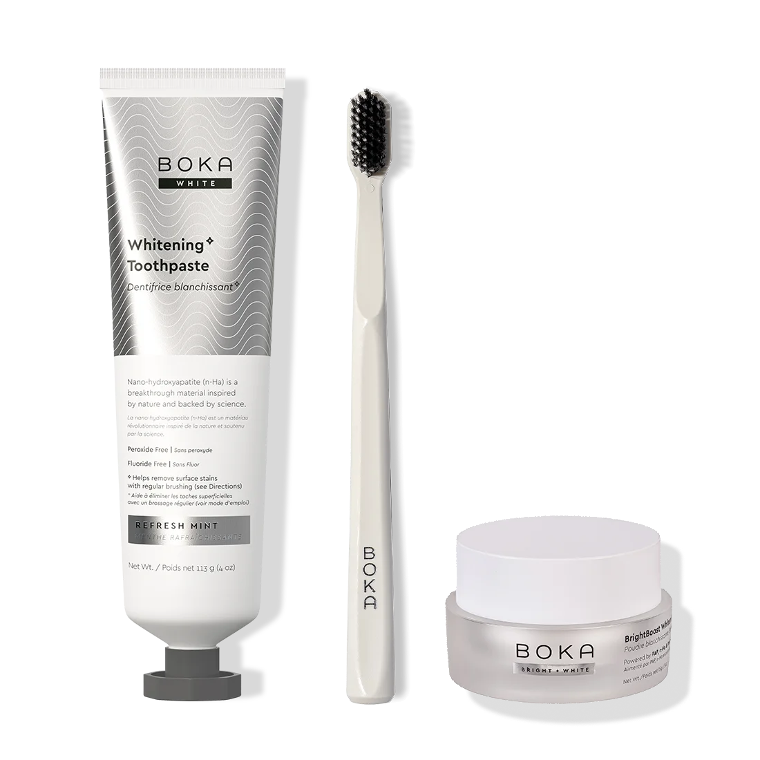 Boka toothpaste, toothbrush, and whitening powder on a white background