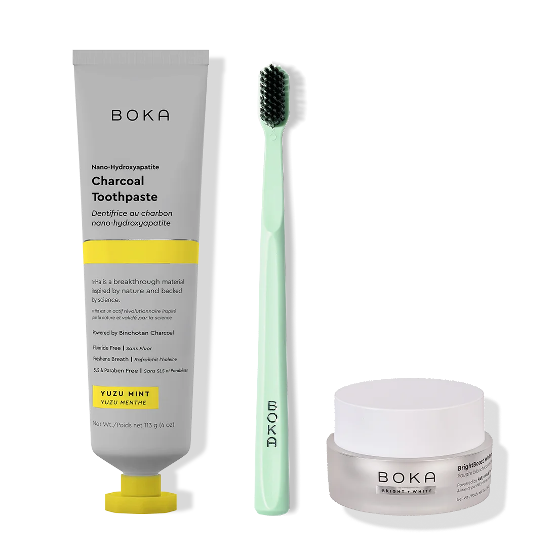Boka toothpaste, toothbrush, and whitening powder on a white background