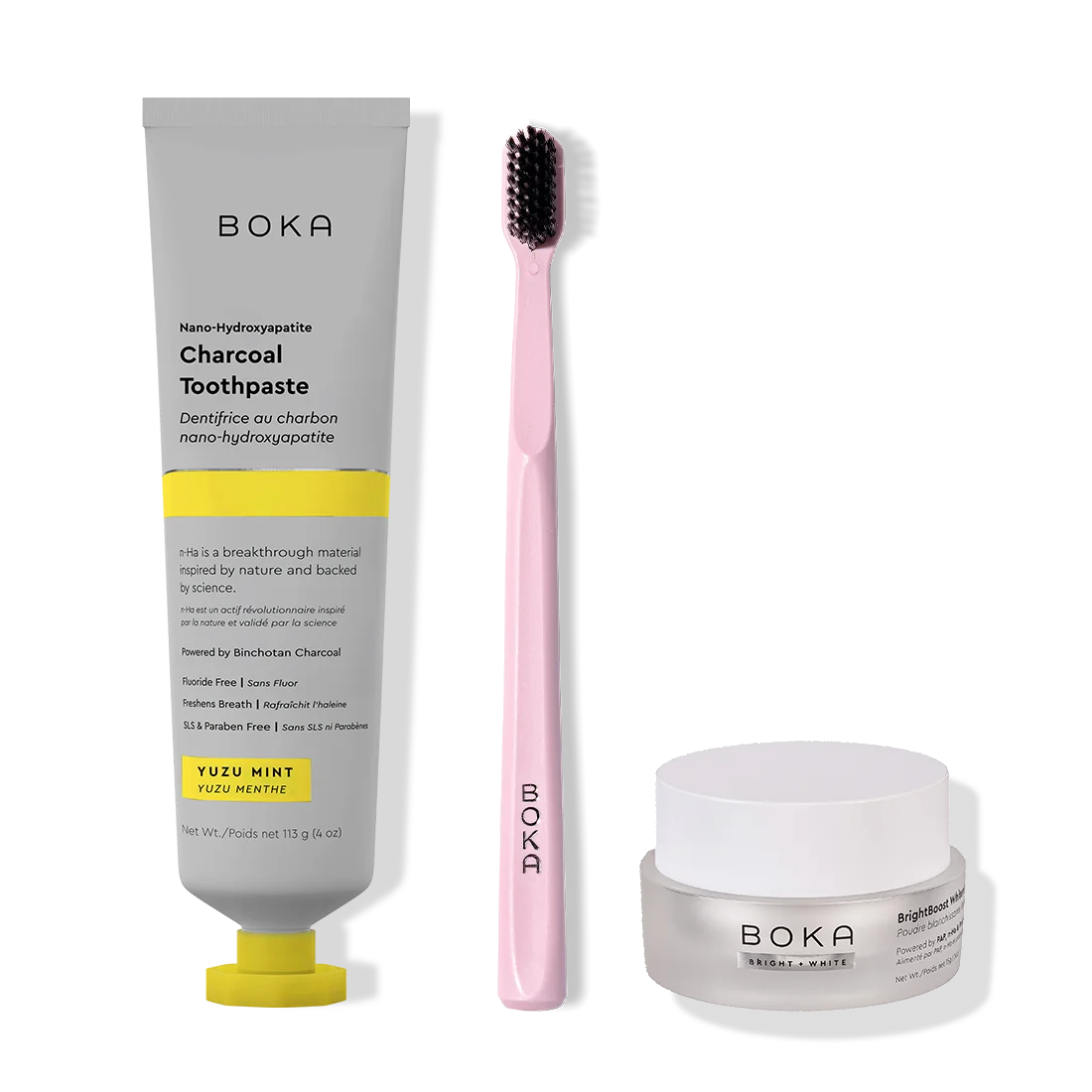 Boka toothpaste, toothbrush, and whitening powder on a white background