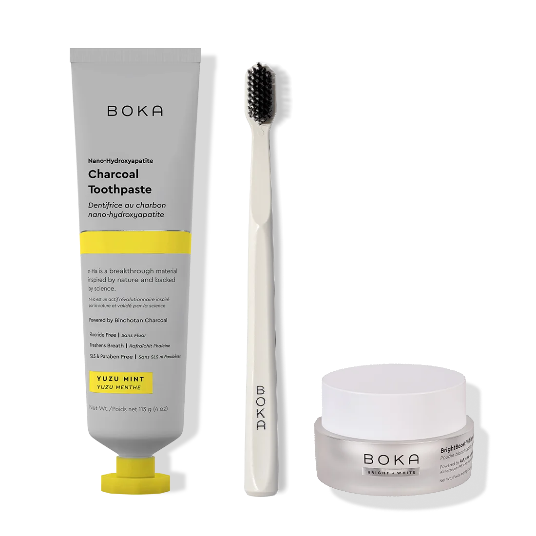 Boka toothpaste, toothbrush, and whitening powder on a white background