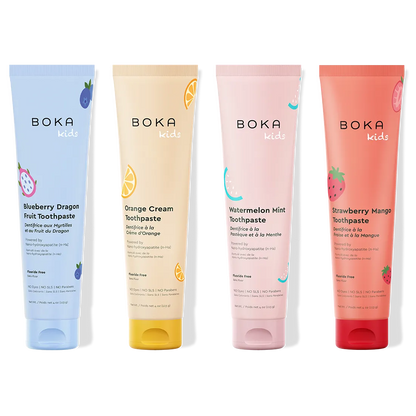 Four Boka Kids toothpaste tubes in different flavors on a white background