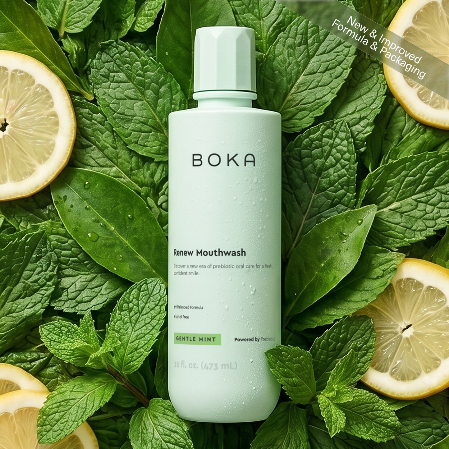 Boka mouthwash bottle surrounded by green leaves and lemon slices on a green background