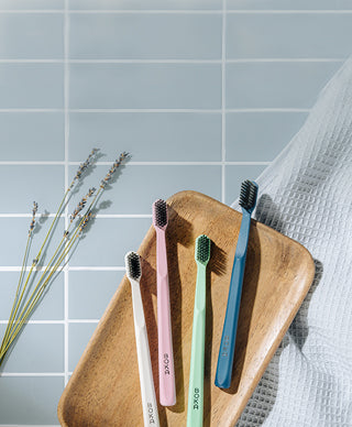 Classic Brush 4 Pack with white pink green blue toothbrushes