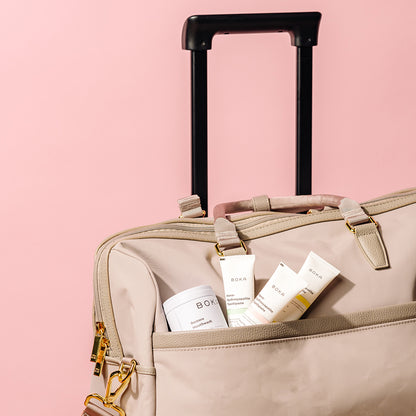 Boka oral care assortment in pocket of travel suitcase.