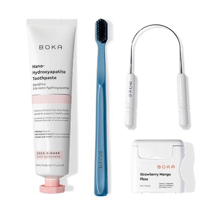 Boka Starter Kit with nano-hydroxyapatite toothpaste, charcoal toothbrush, and flosses side by side.